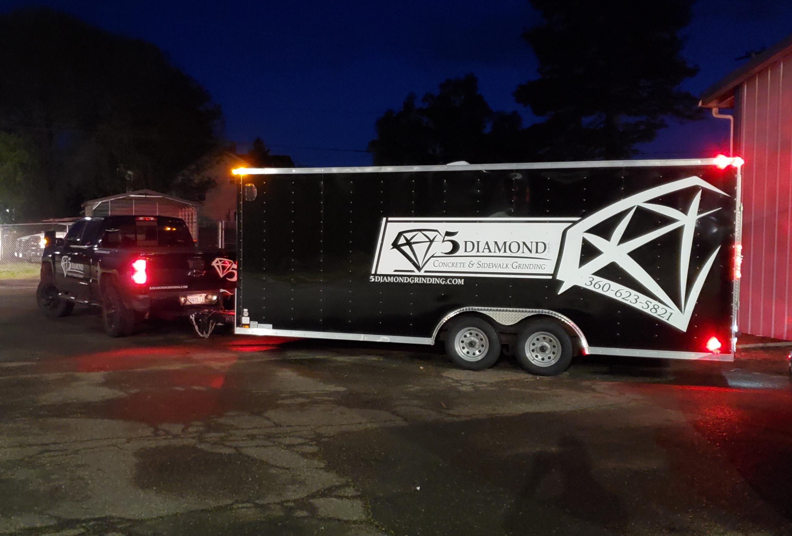 5 Diamond branded truck and concrete grinding trailer at dusk